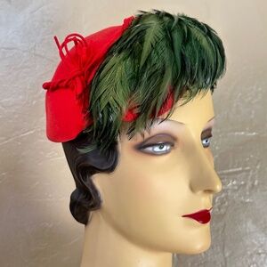 FESTIVE 1950S' RED FELT HAT WITH OLIVE GREEN FEATHERS